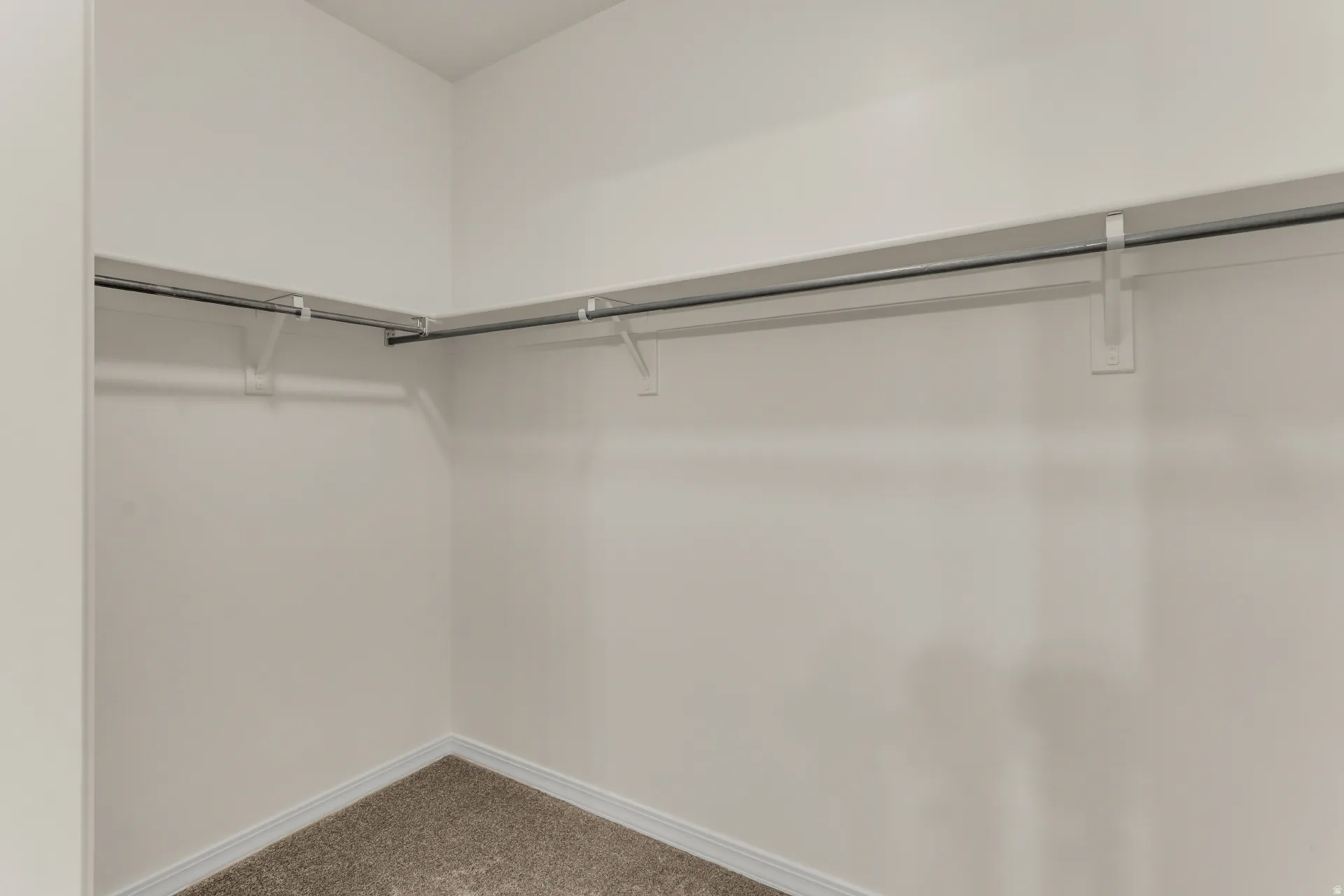 Primary bedroom walk-in closet.