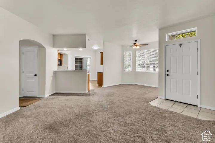 Living room, with view of dining area and kitchen.