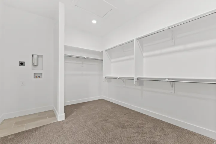 Integrated laundry connections, ample shelving, and hanging rods