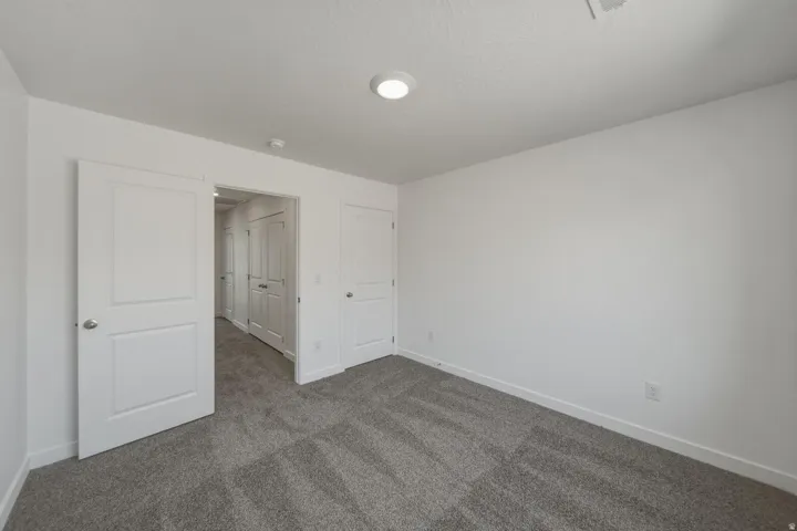 Neutral color palette with textured carpet flooring