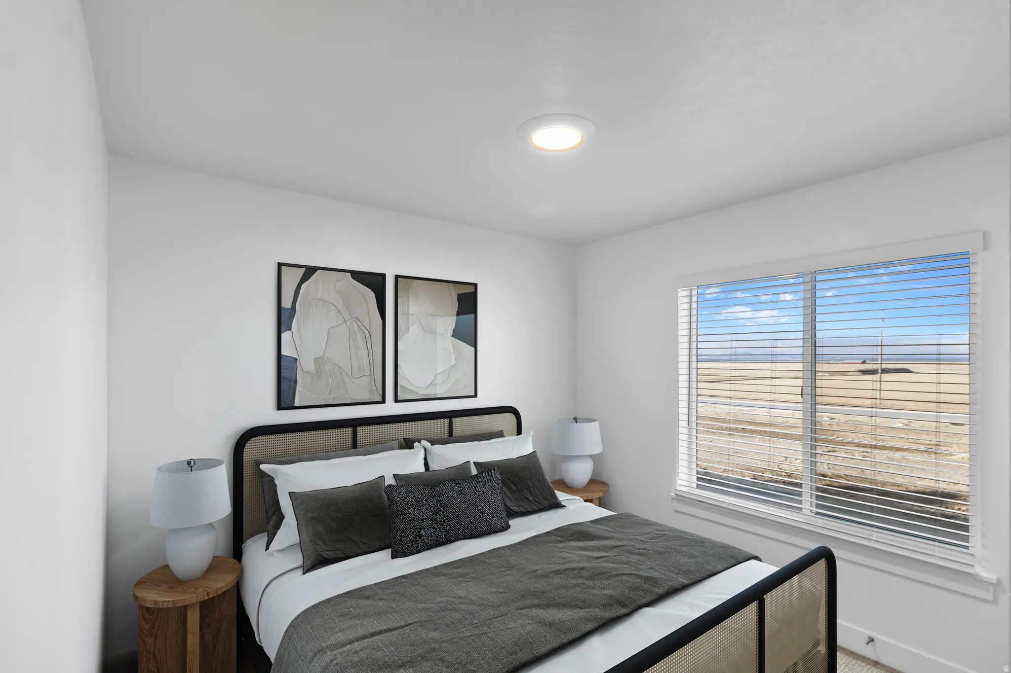 White walls featuring a large window with horizontal blinds and a ceiling-mounted light fixture