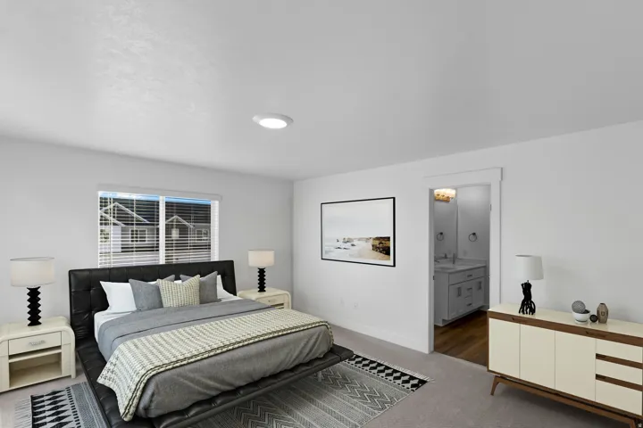 White walls, recessed ceiling lighting, light carpet flooring, and a bathroom with a vanity and wood-finish flooring