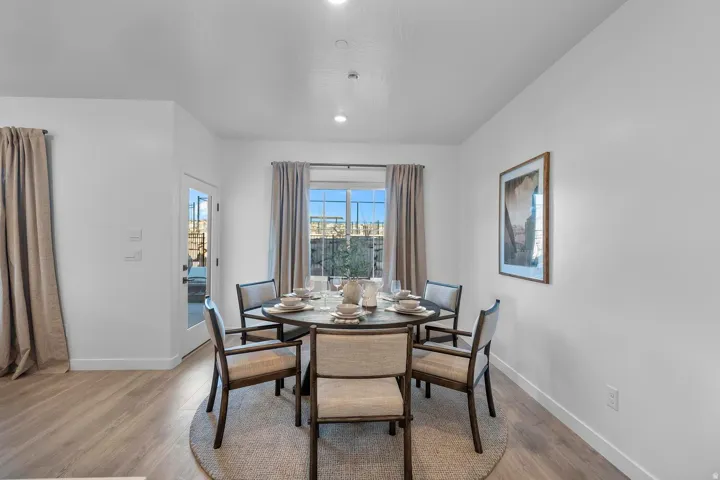 Wood-finish flooring, recessed lighting, and a window with natural light