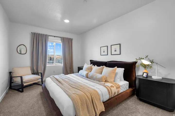 Recessed lighting, window with drapes, and carpeted flooring