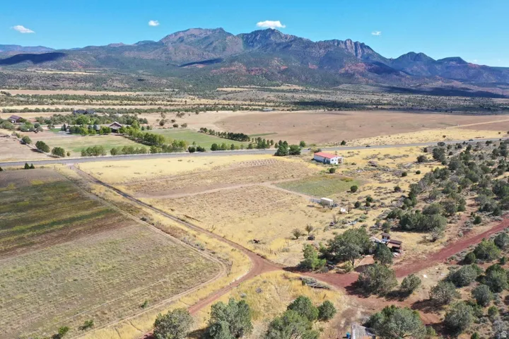 Expansive rural acreage with varied topography, including tilled fields and natural vegetation