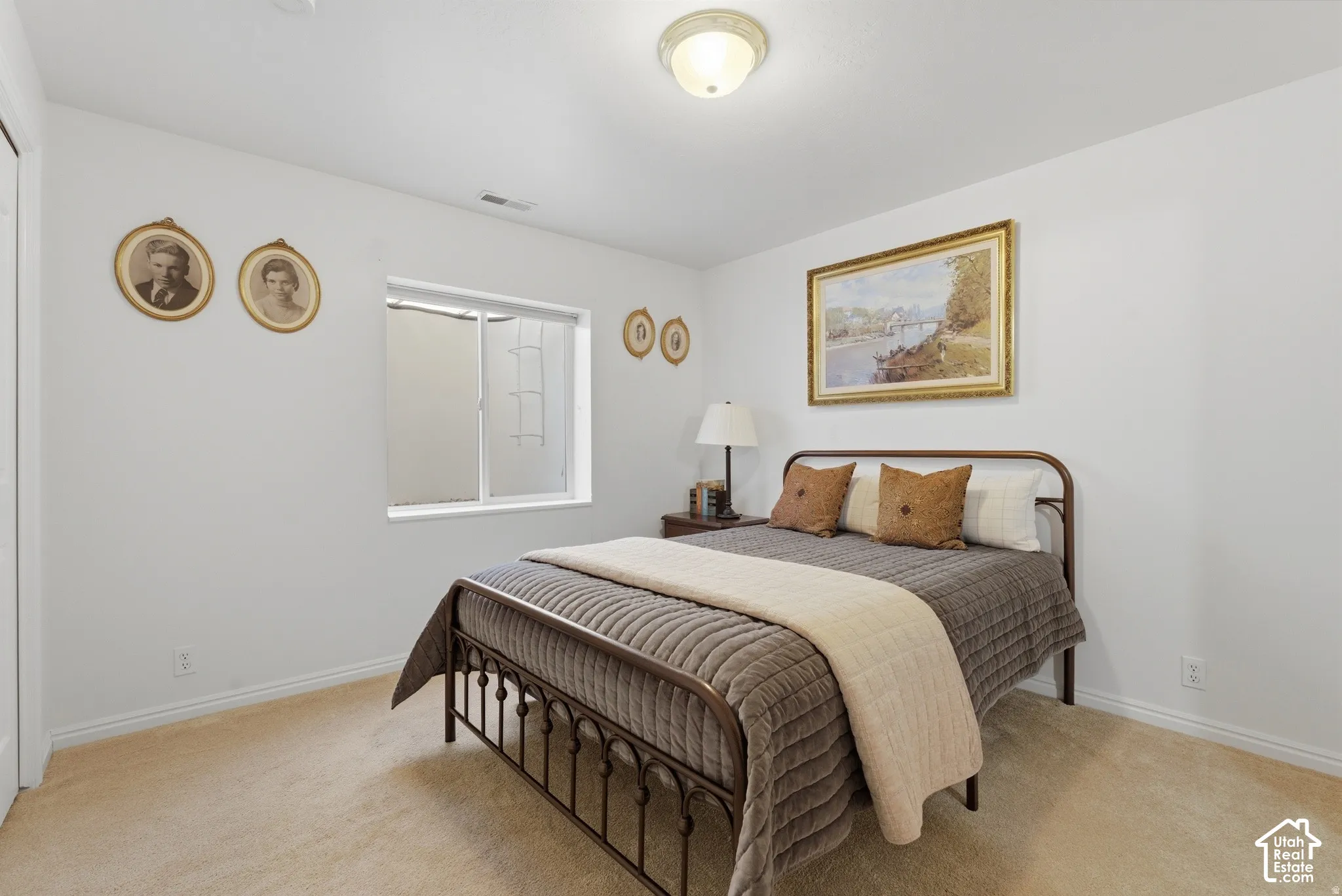 Recessed window, neutral wall paint, flush mount ceiling light fixture, and carpeted flooring