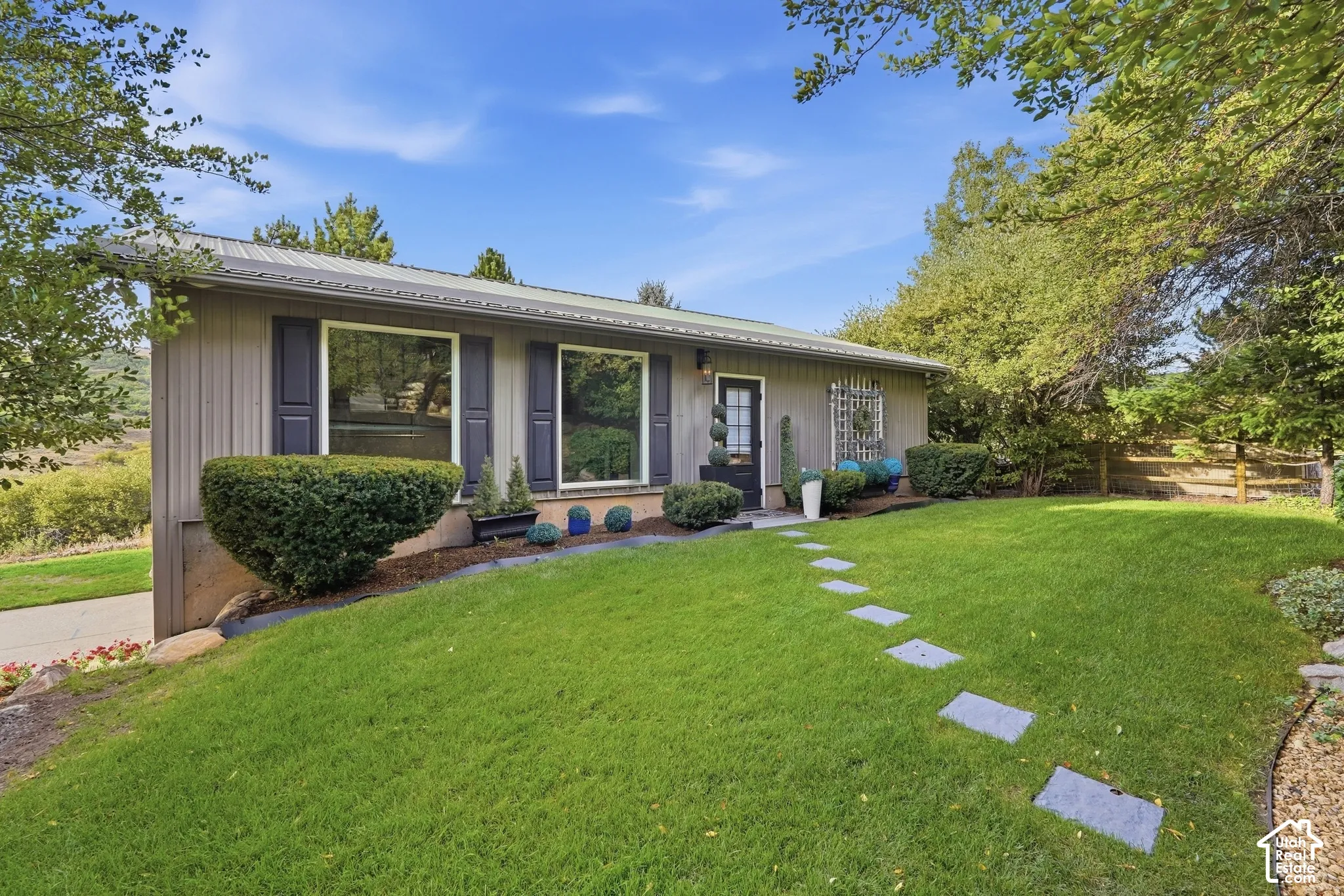 Hardie board siding exterior with a metal roof