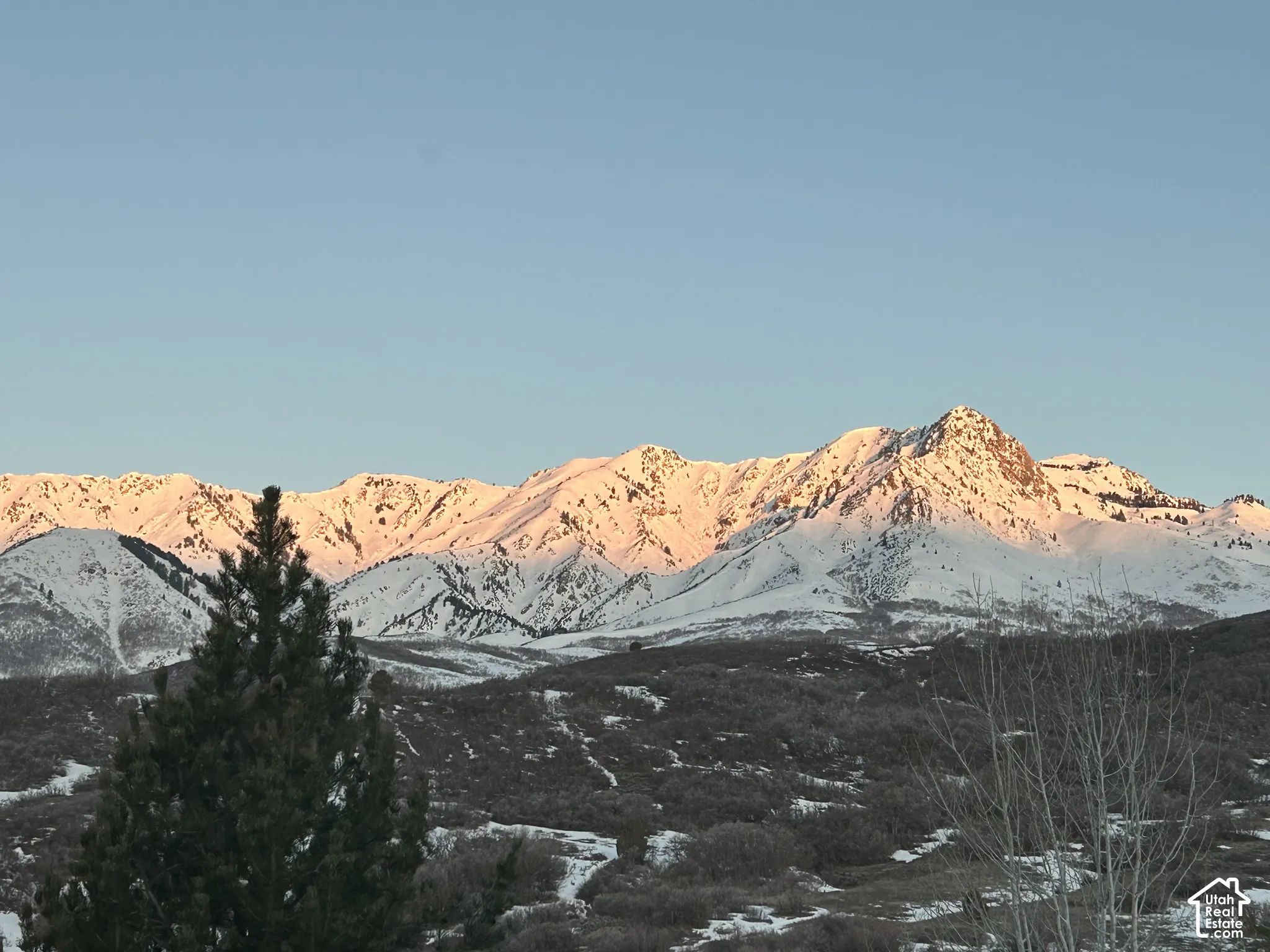 Snow-capped mountains with sunlit peaks