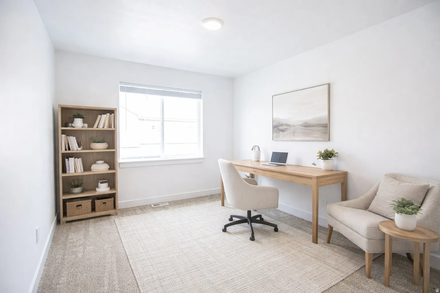 Recessed lighting, light-toned carpeting, and a large window providing natural light