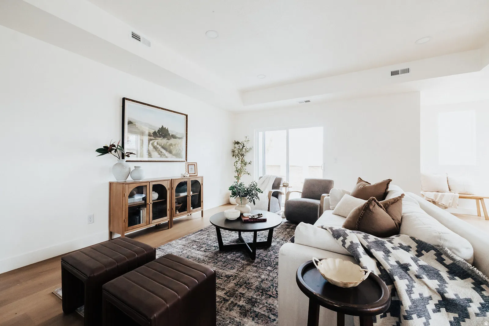 Expansive living area with light wood-finish flooring