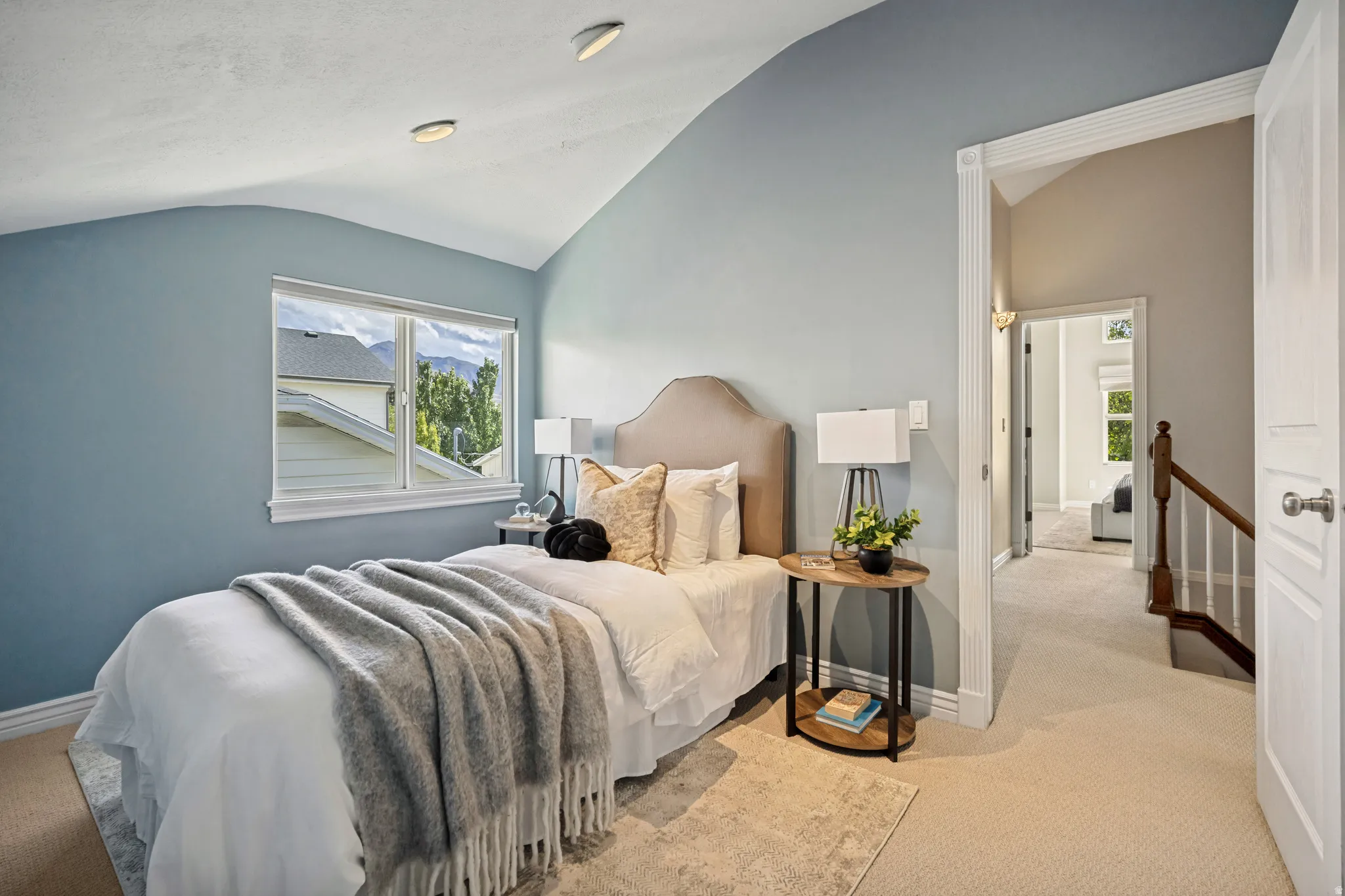 Third bedroom up, angled ceiling with recessed lighting