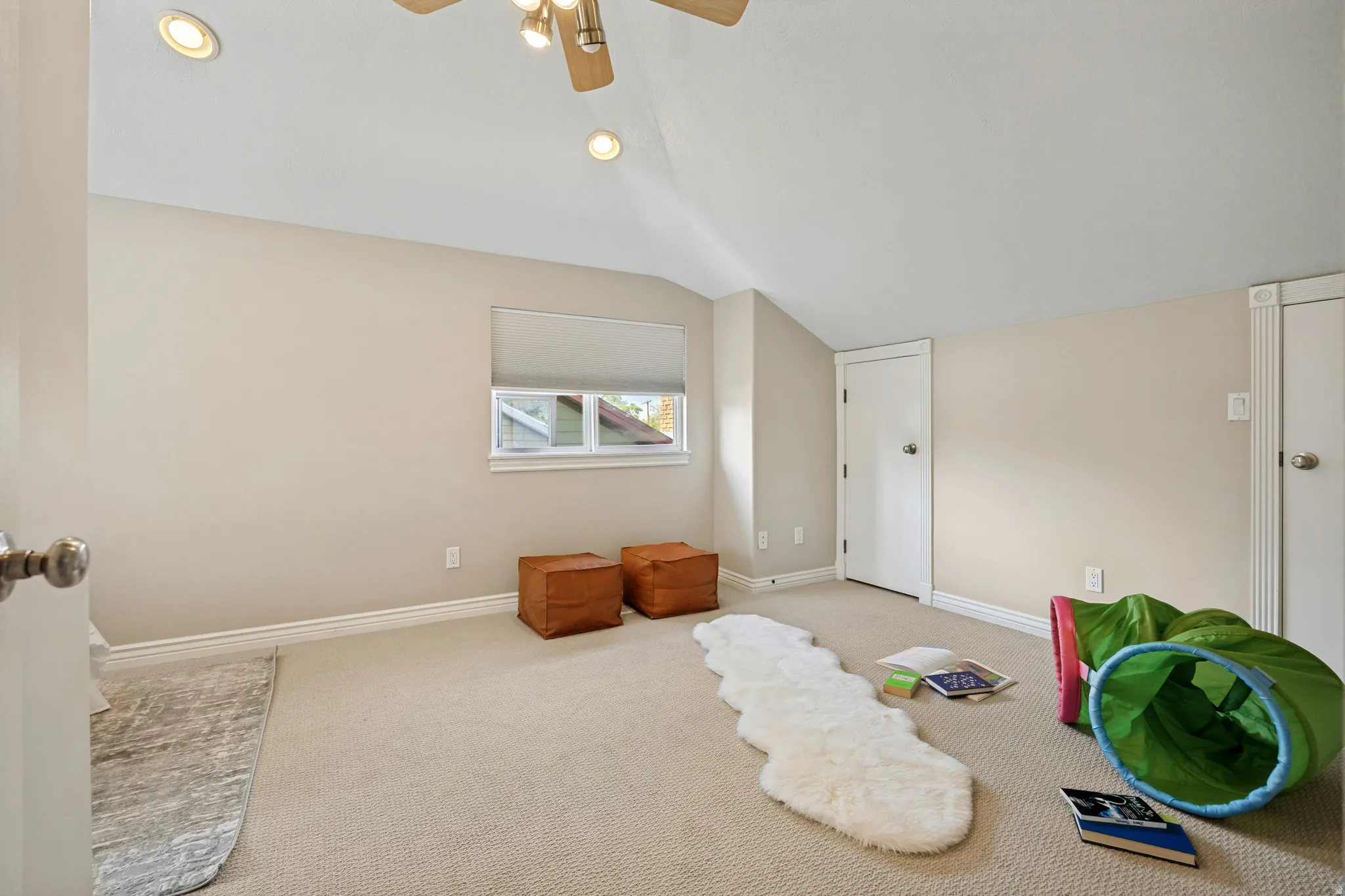 Second bedroom up with vaulted ceiling, recessed lighting and ceiling fan, neutral carpet flooring, window with blinds, and white trim