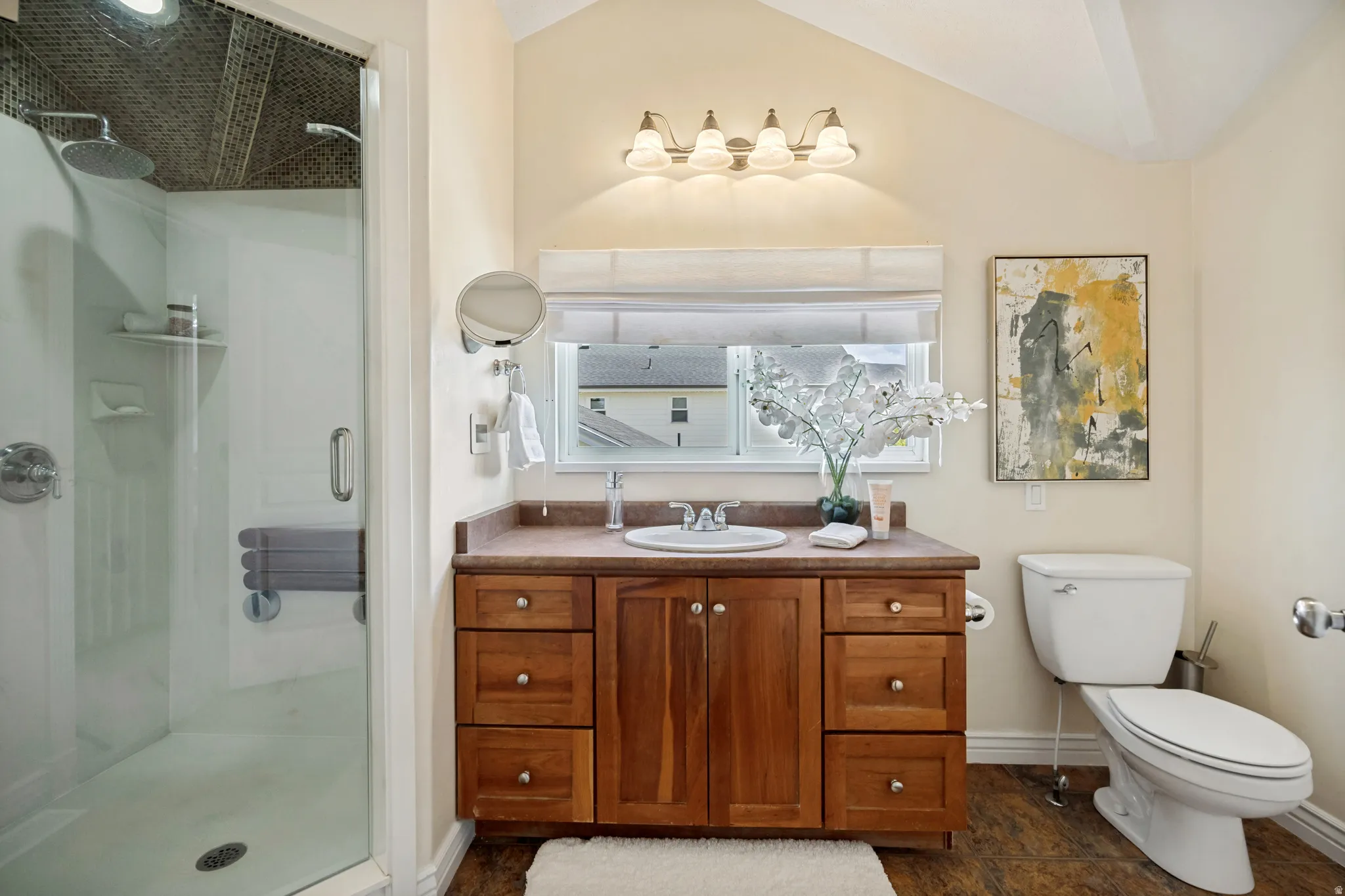 Glass-enclosed shower with a fold-down bench and dual shower heads