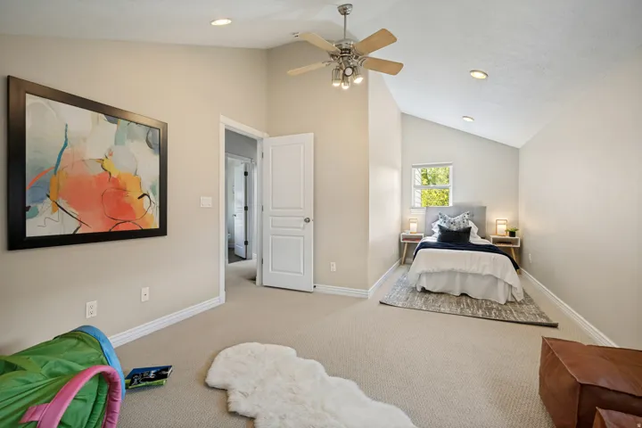 Second bedroom up, vaulted ceilings with recessed lighting, ceiling fan, and carpeted flooring
