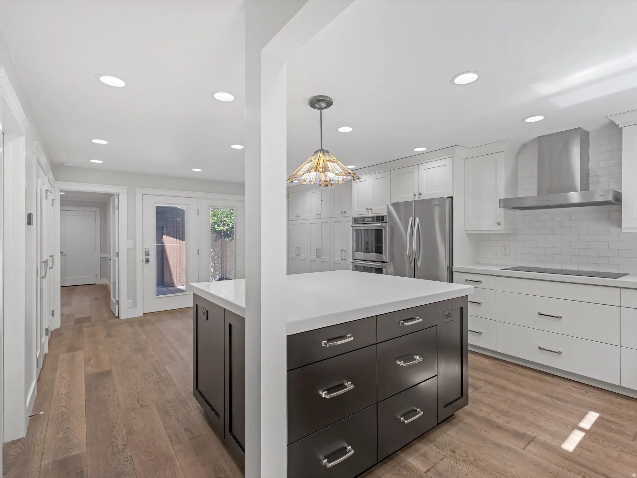 From the Kitchen you can walk through the French Doors and into the private Patio