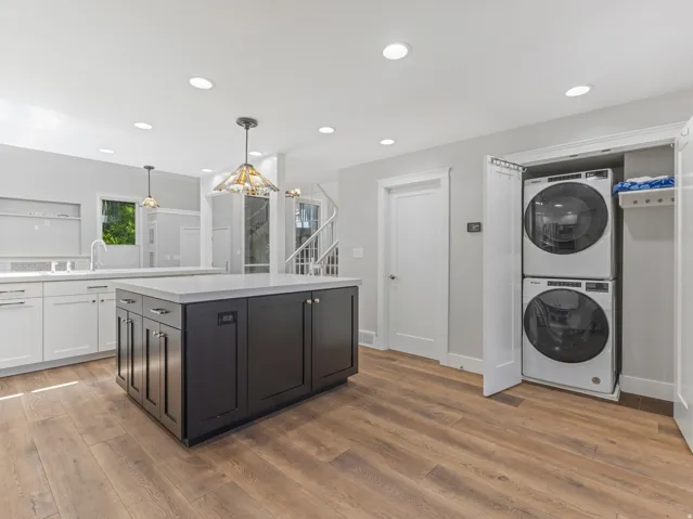 One of the TWO Laundry Areas is on the Main Floor, tucked into a Closet where you don't have to see it until you're ready too use it.