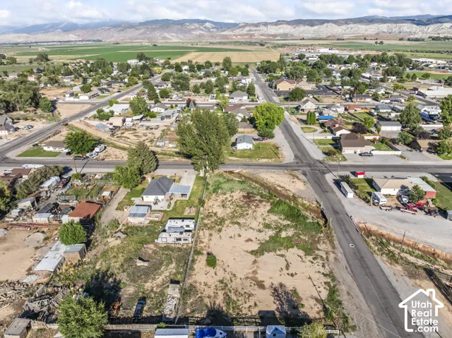 Expansive land parcel featuring direct road access and surrounded by established residences