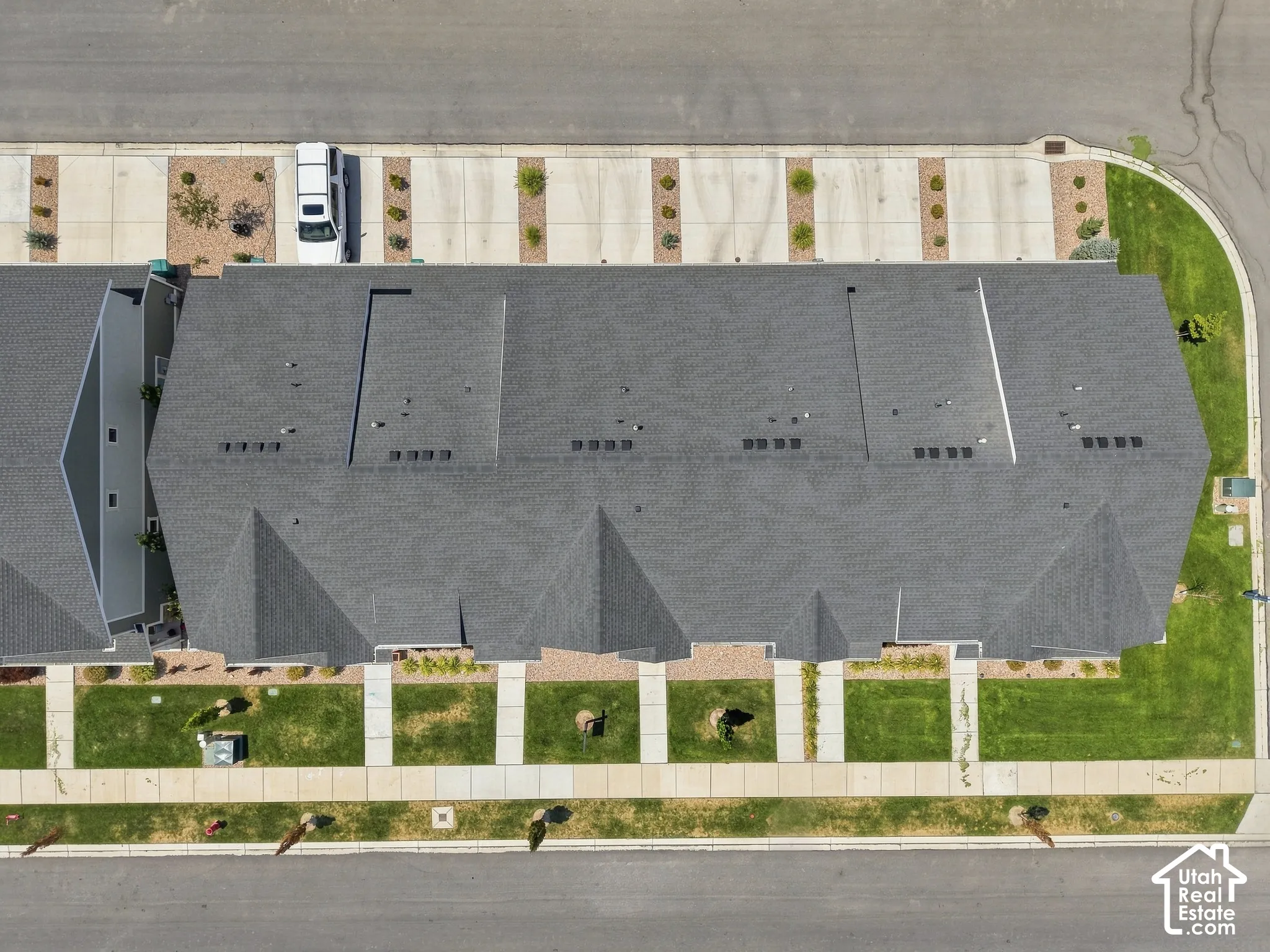 Pitched shingle roofline with multiple gables