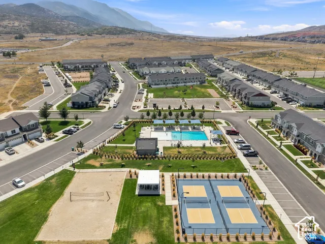 Community amenities featuring a swimming pool, volleyball court, and two pickleball courts