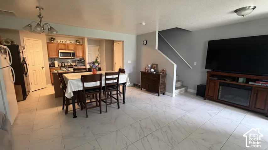 Light-toned tile flooring throughout the open-concept living space