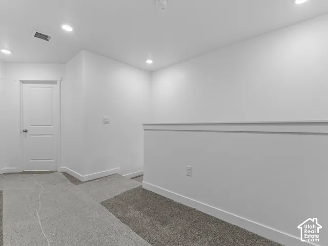 Recessed ceiling lighting illuminates the space