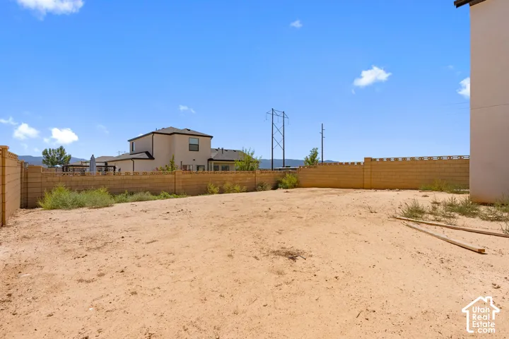 Expansive undeveloped lot with block perimeter fencing