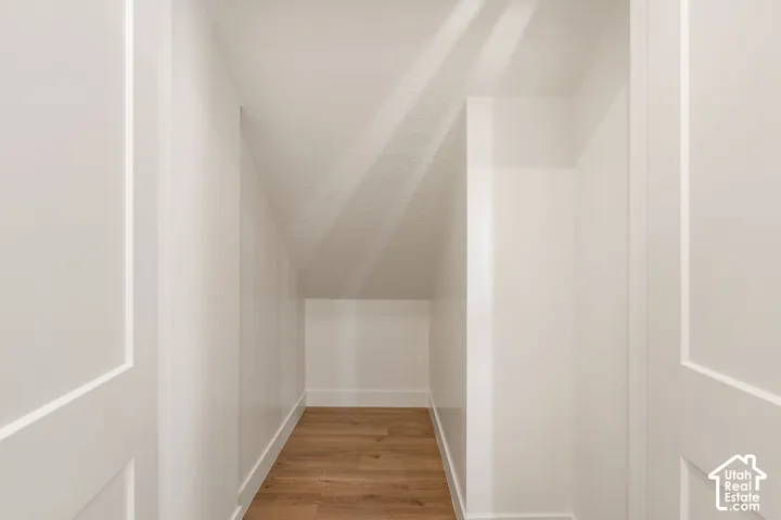 Wood-finish flooring with crisp white walls and white trim
