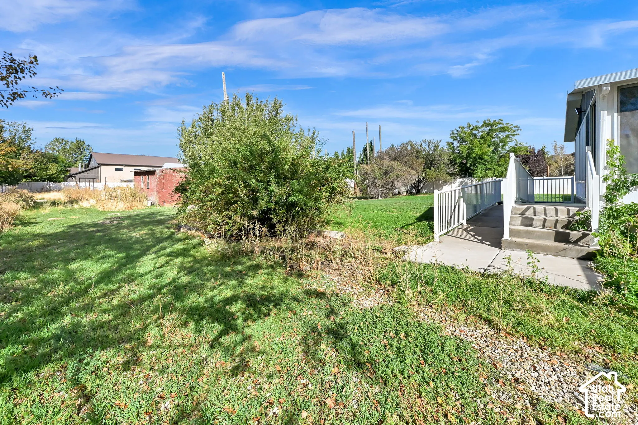 Concrete steps and ramp entry to the property
