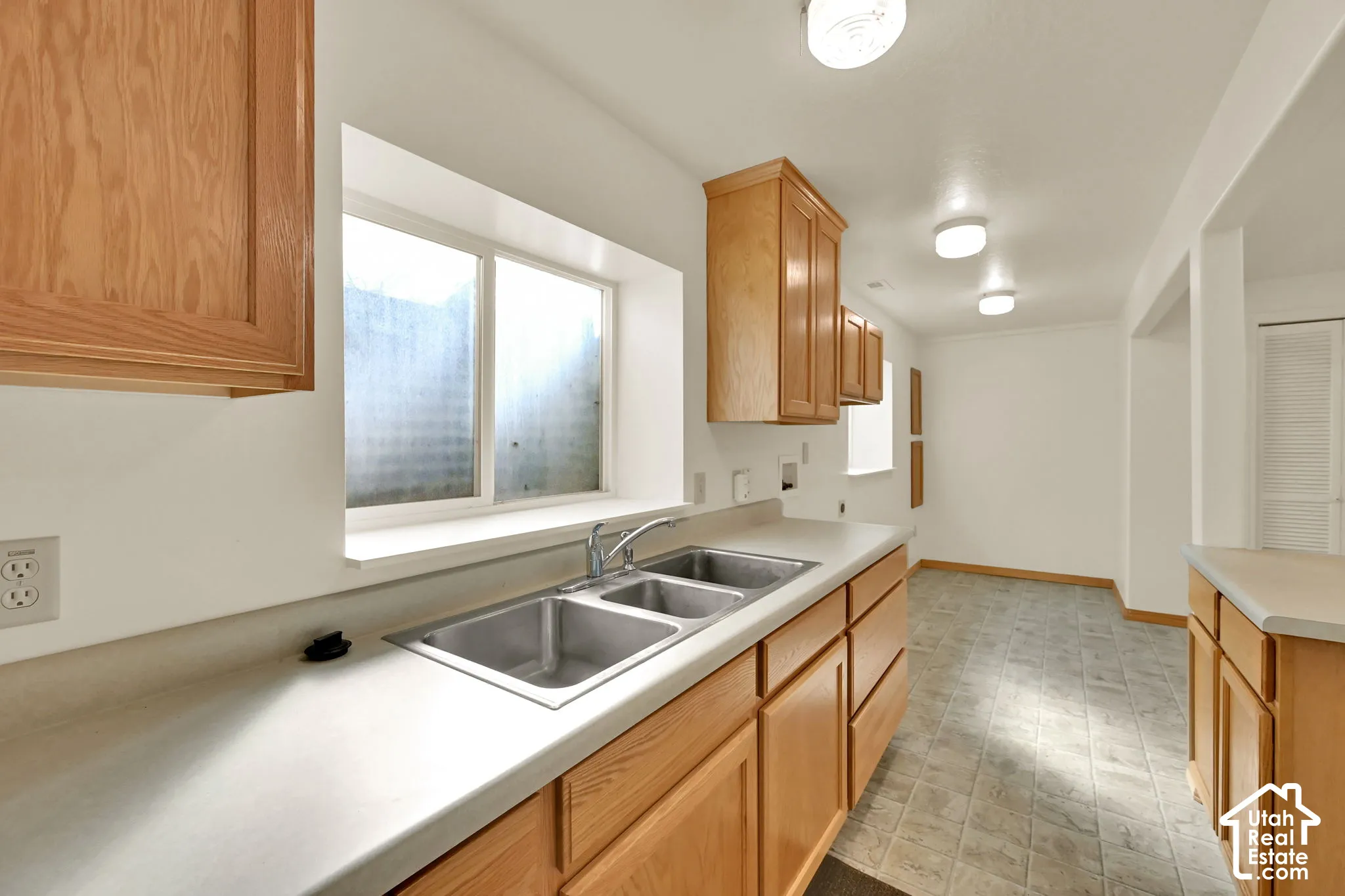 Double basin stainless steel sink with a chrome faucet