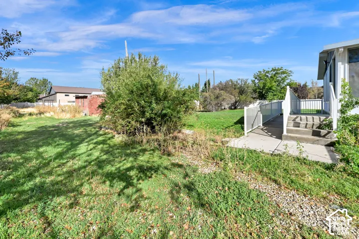 Concrete steps and ramp entry to the property