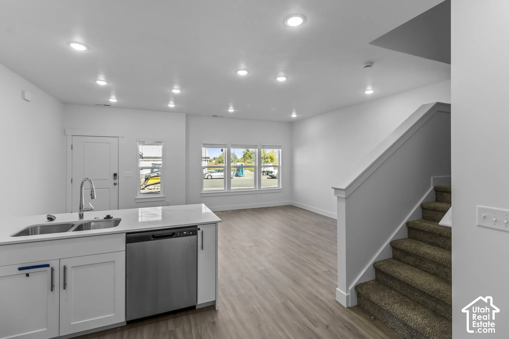 Kitchen island with integrated stainless steel sink and dishwasher