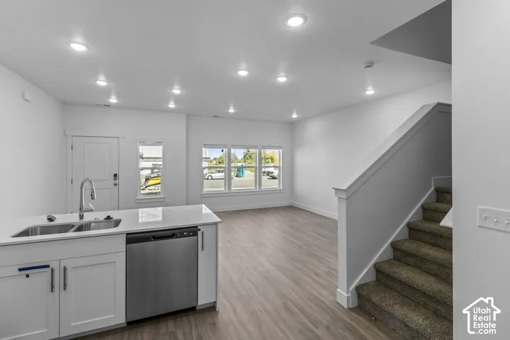 Kitchen island with integrated stainless steel sink and dishwasher