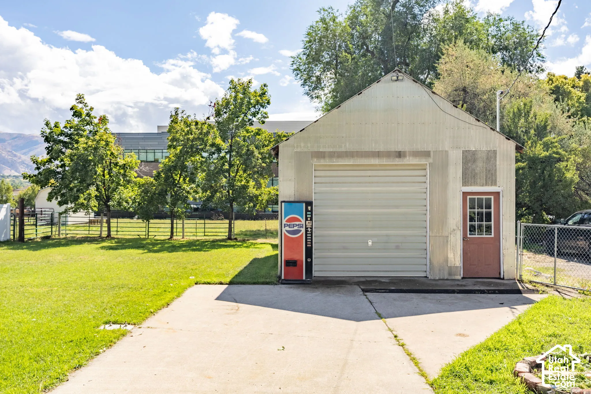 Detached structure with a roll-up door and separate side entry