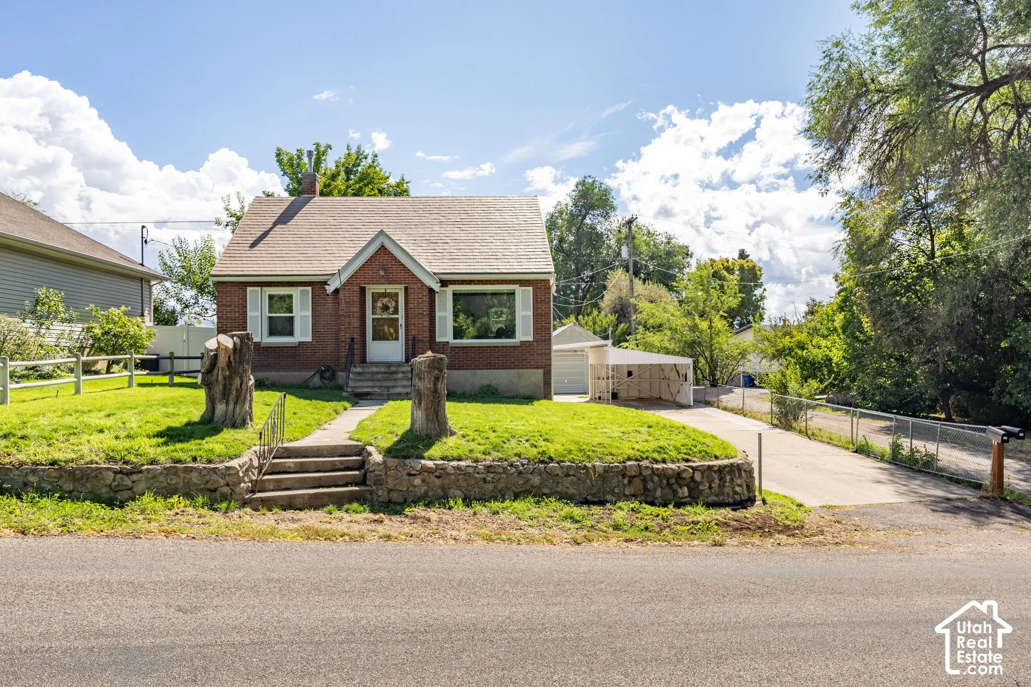 Brick exterior with white window shutters
