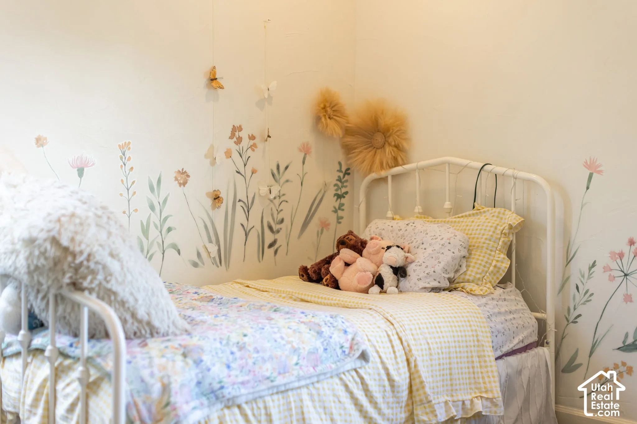 Accent wall featuring painted floral and botanical motifs