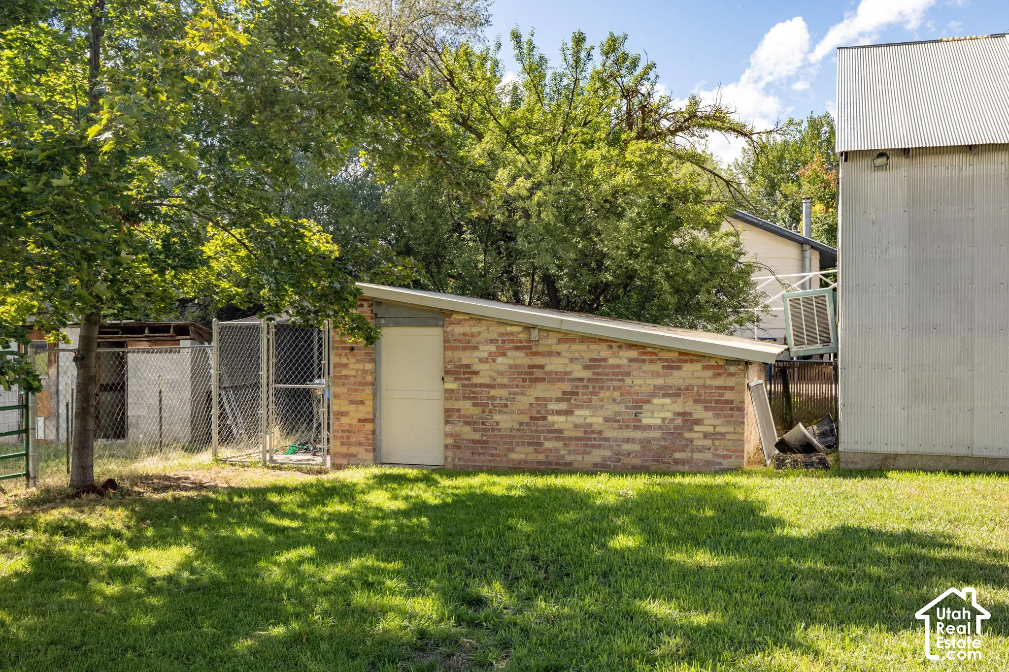 Brick-clad ancillary structure with a sloped roof