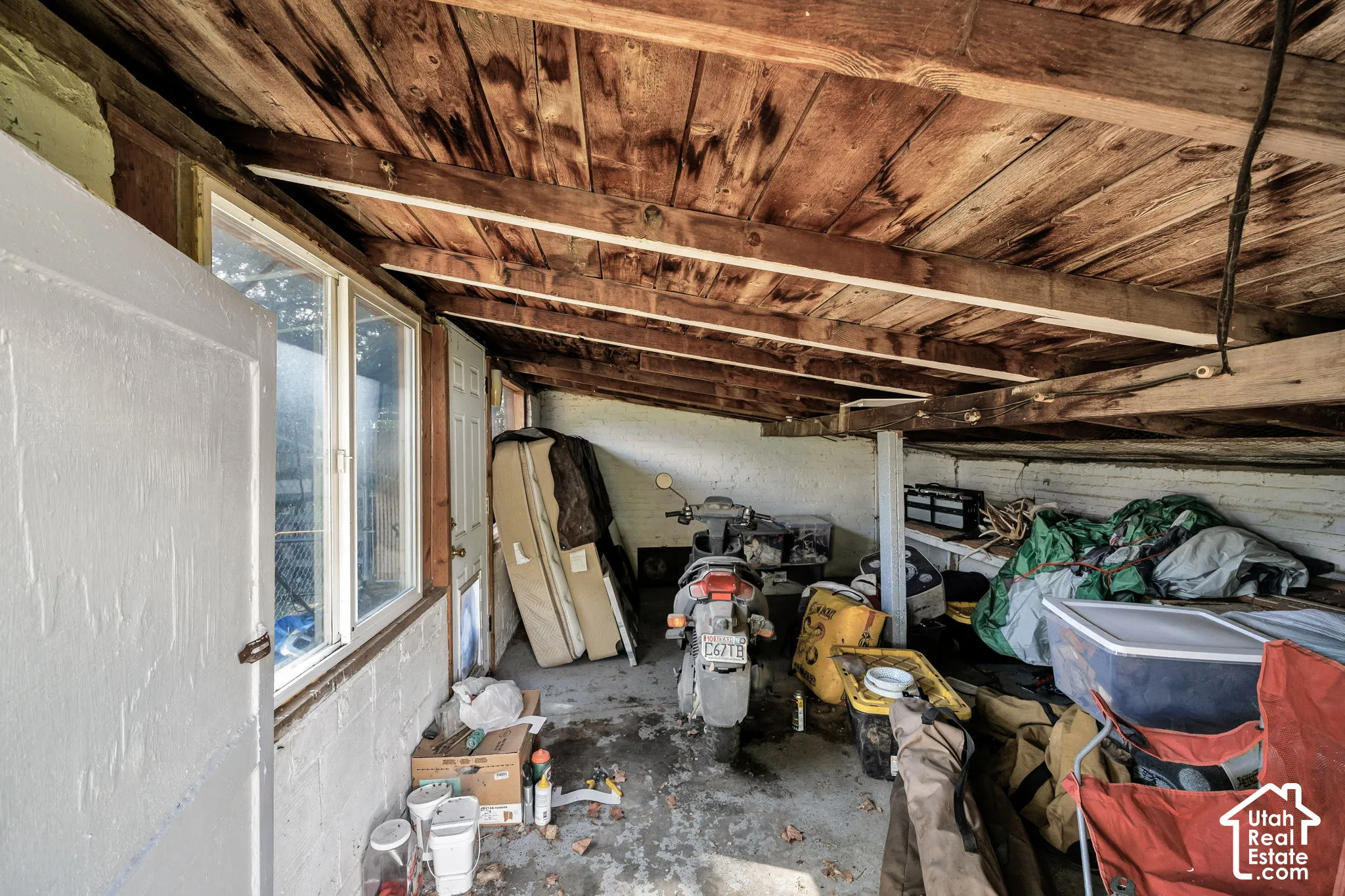 Inside extra storage shed with sloped roof
