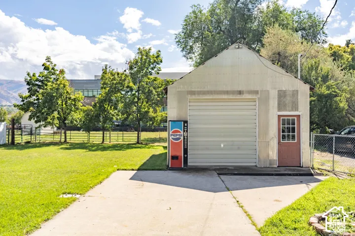 Detached structure with a roll-up door and separate side entry