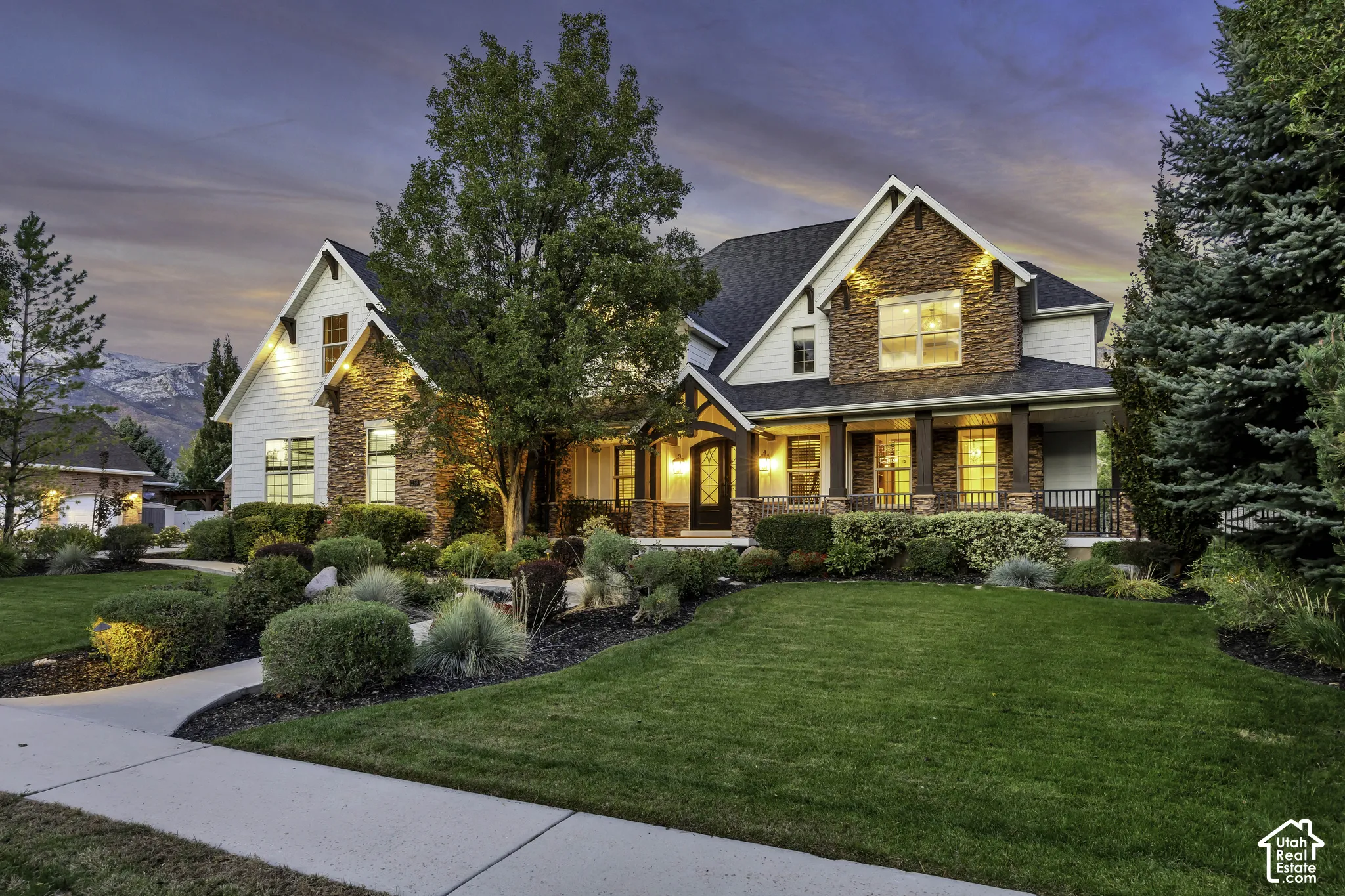 Stone and siding exterior with gabled roof lines