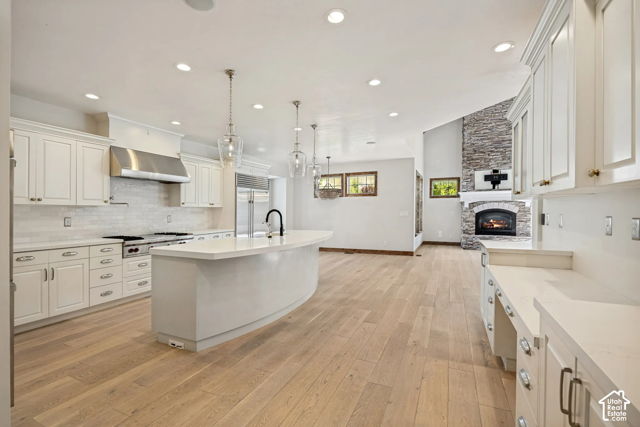 Expansive wood-finish flooring throughout