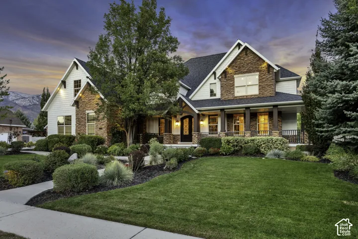 Stone and siding exterior with gabled roof lines