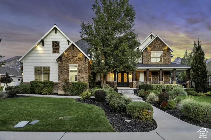 Stone and siding exterior with gabled roof lines
