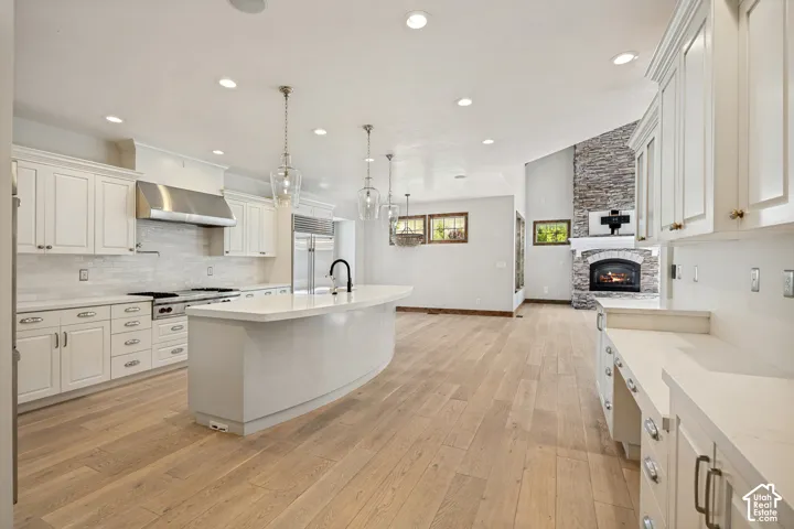 Expansive wood-finish flooring throughout