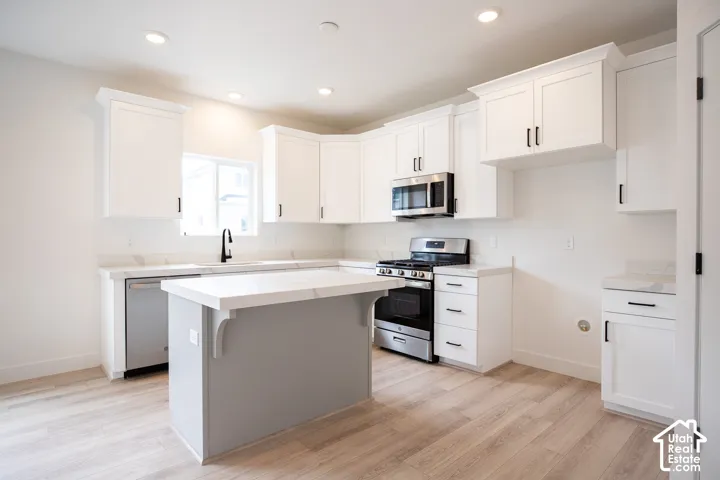 Kitchen with island and upgraded cabinets