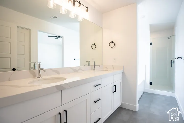 Primary bathroom with double sinks and separate tub and shower