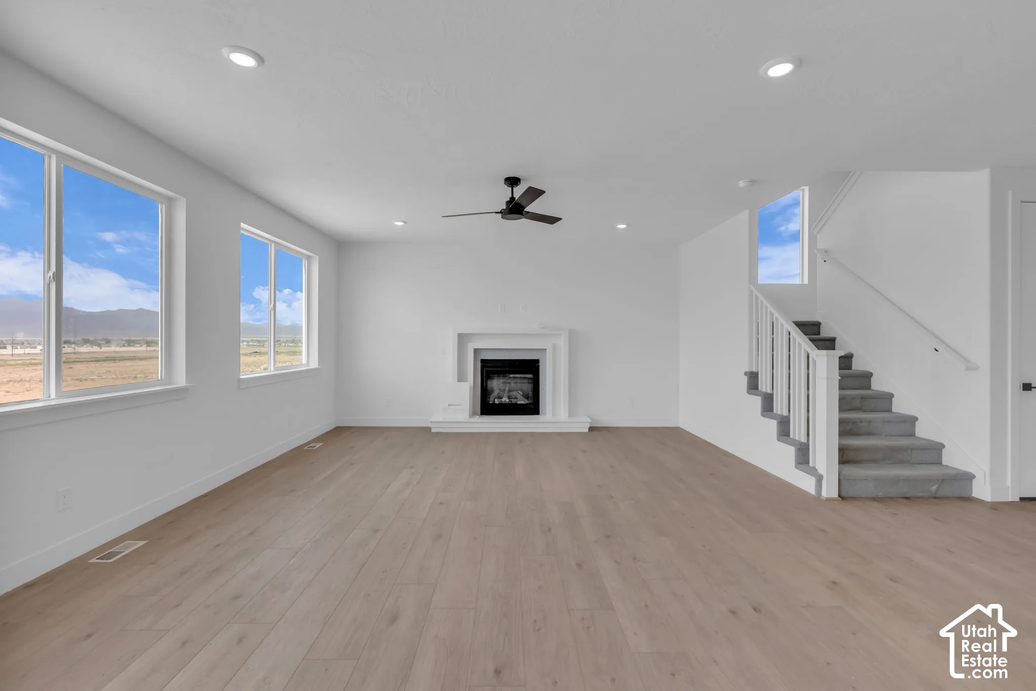Great room with large windows and exquisite mountain views.  Gas fireplace in large gathering room.