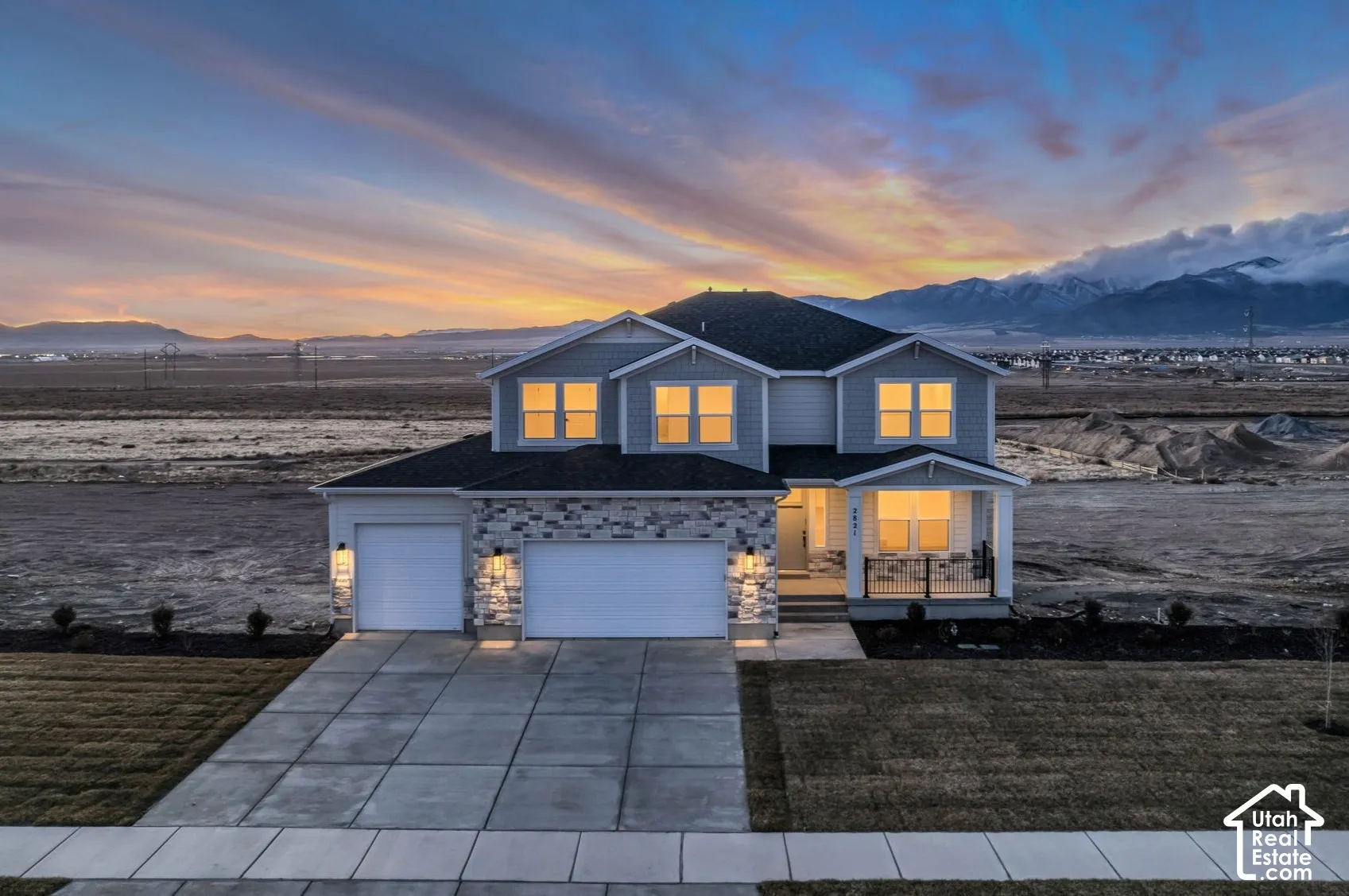View of home from the east showing incredible mountain views at sunset.