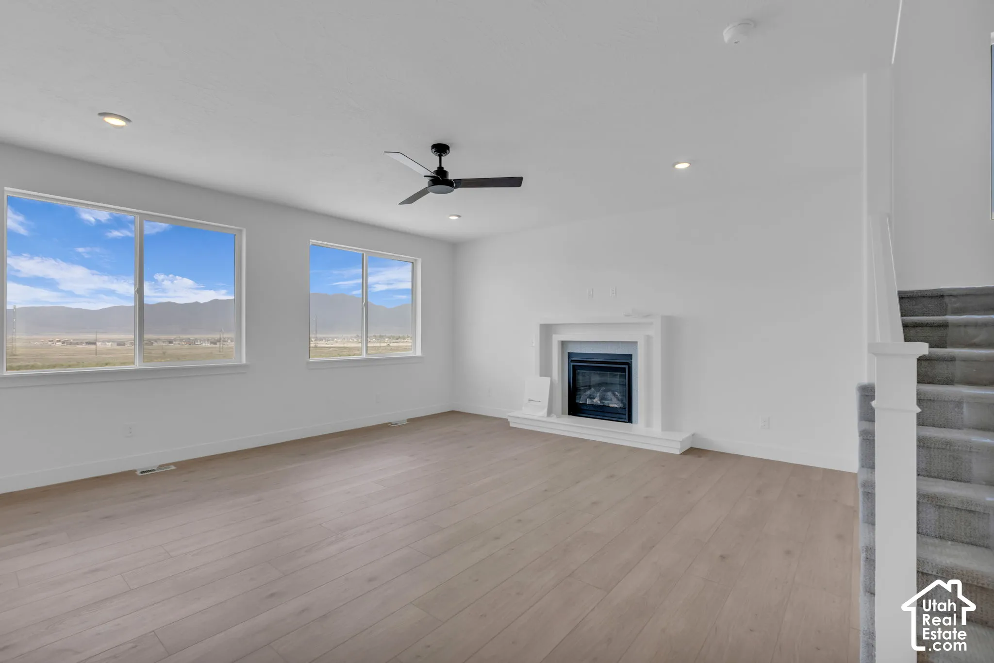 Great room with large windows and exquisite mountain views.  Gas fireplace in large gathering room.