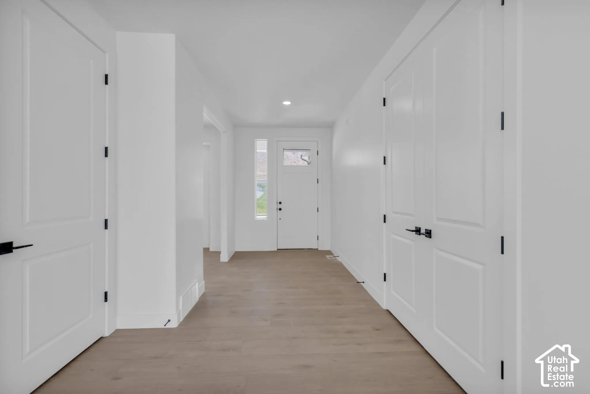 Spacious entry foyer with sidelight and 8' entry door with transom glass.