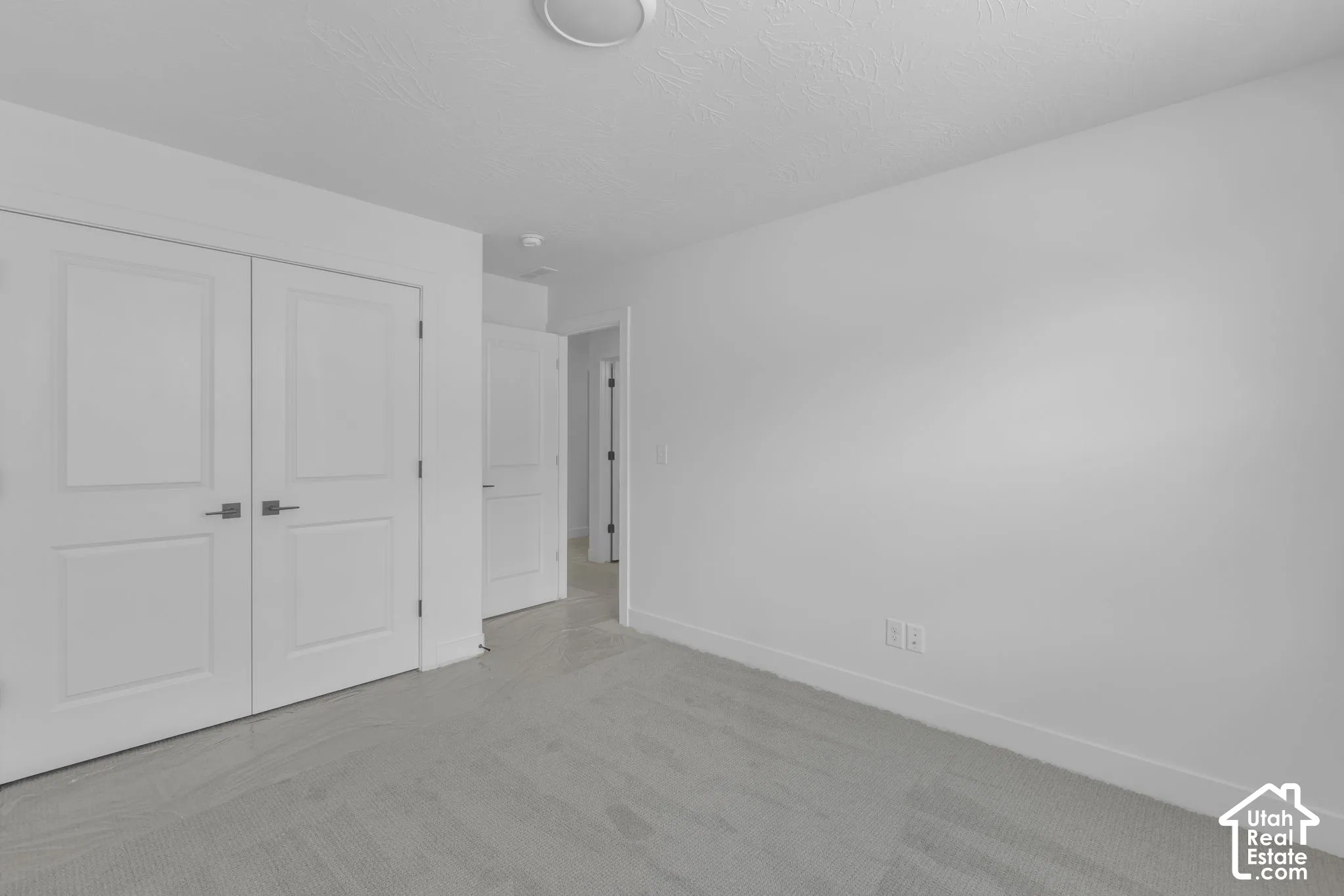 Large oversized secondary bedroom with double door closet.